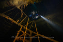 Diver in the stairwell of a wreck