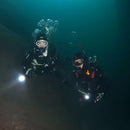 Scuba divers practicing skills in deep water for PADI Advanced Open Water course.